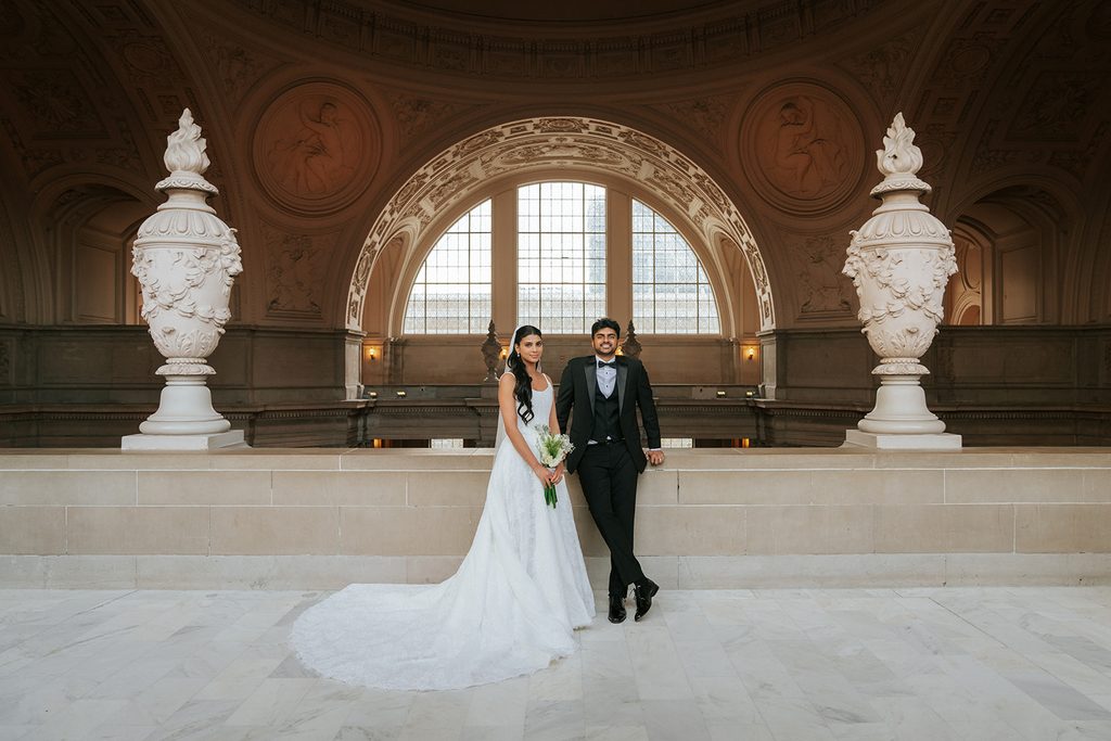 Ritika and Suhas smiling together on their San Francisco wedding day