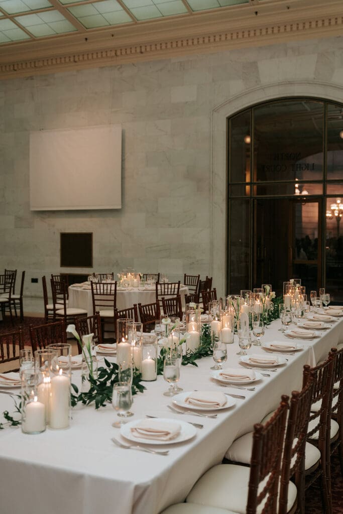 Wedding dinner tables set in the North Light Court at SF City Hall