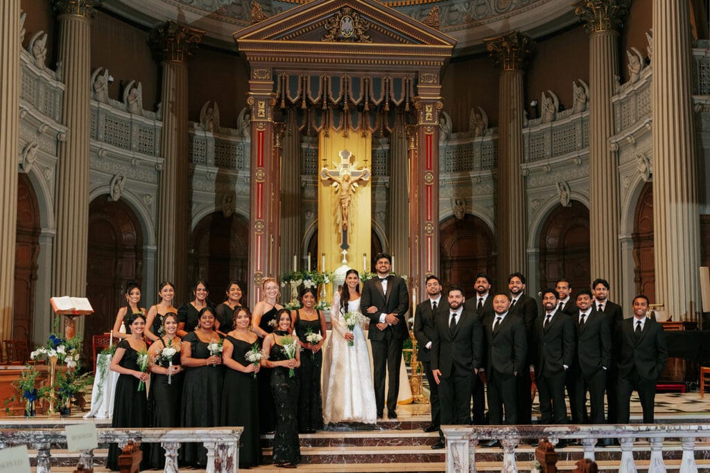 Bridal Party Posing at the altar after their church wedding ceremony