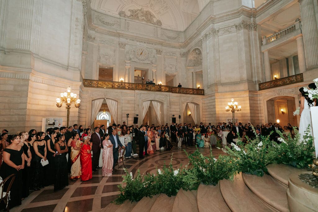 Families celebrating the couple after their church wedding ceremony & SF City Hall